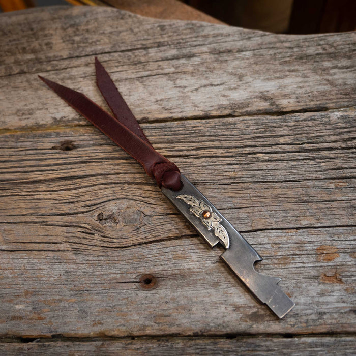 D. Conway Silver Flower Cowboy Tool