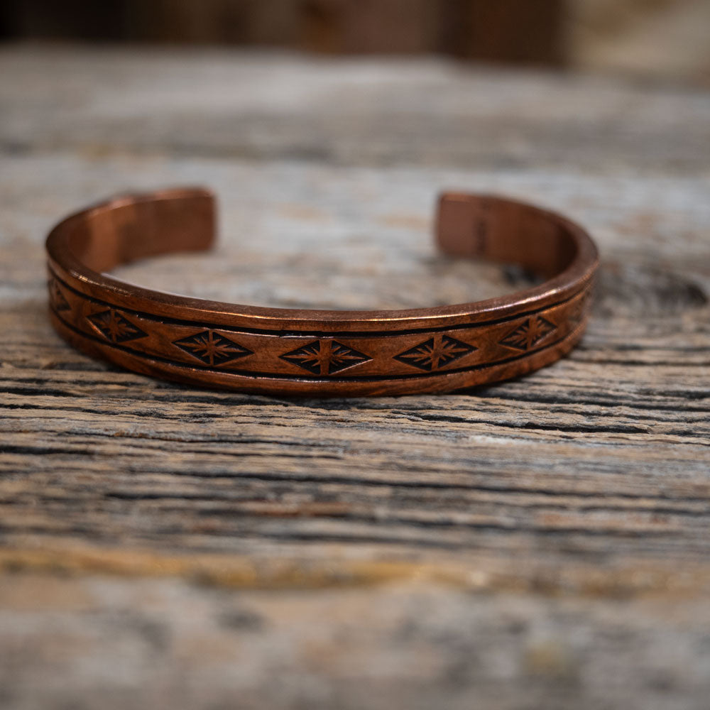 Engraved Copper Cuffs by F. Coriz