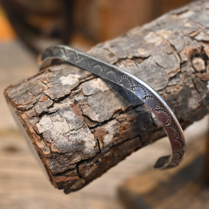 Silver bracelet on a wooden surface